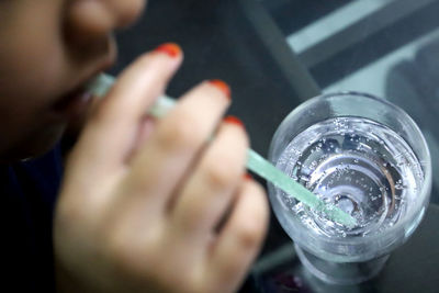 Close-up of hand holding drink