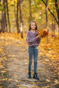 Portrait of girl in autumn