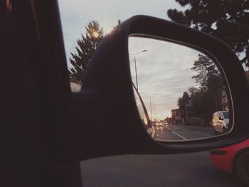 Reflection of car on side-view mirror