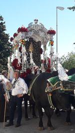 Group of people in traditional clothing in city