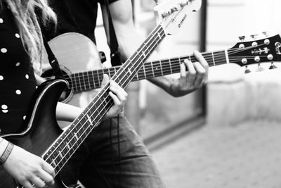 Close-up of guitar playing guitar