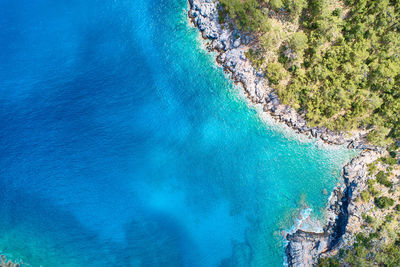 High angle view of rocks by sea