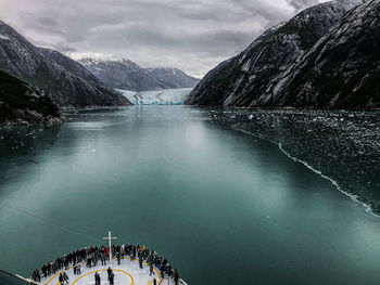 Scenic view of lake and mountains against sky . the dawes glacier in alaska 