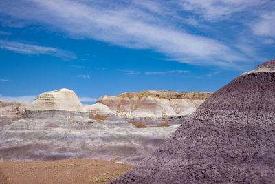 Rock formations on landscape against sky