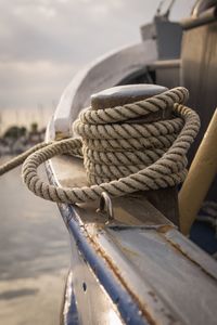 Close-up of rope tied on wooden post