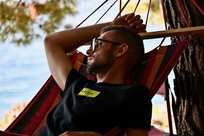 Portrait of young man looking at view