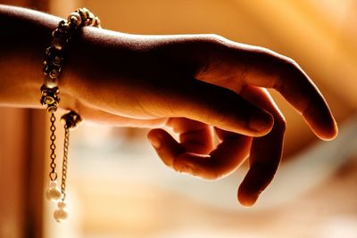 Cropped hand of woman wearing bracelet