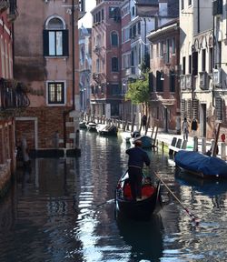 Boats in canal . venice