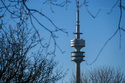 Low angle view of rheinturm tower against clear sky