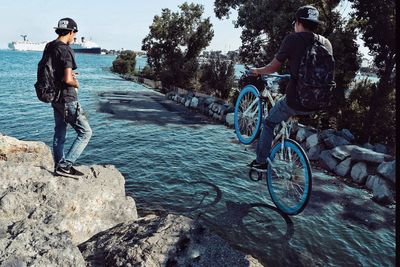 Man riding bicycle on water