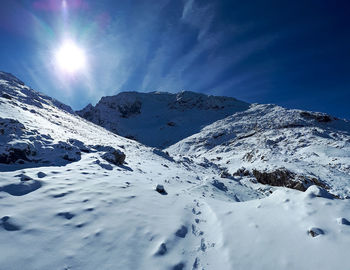 Scenic view of snowcapped mountains against sky