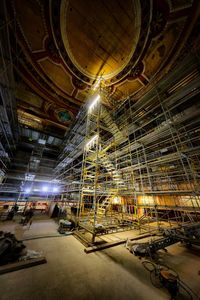 Low angle view of illuminated ceiling at night