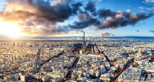 High angle view of cityscape against cloudy sky