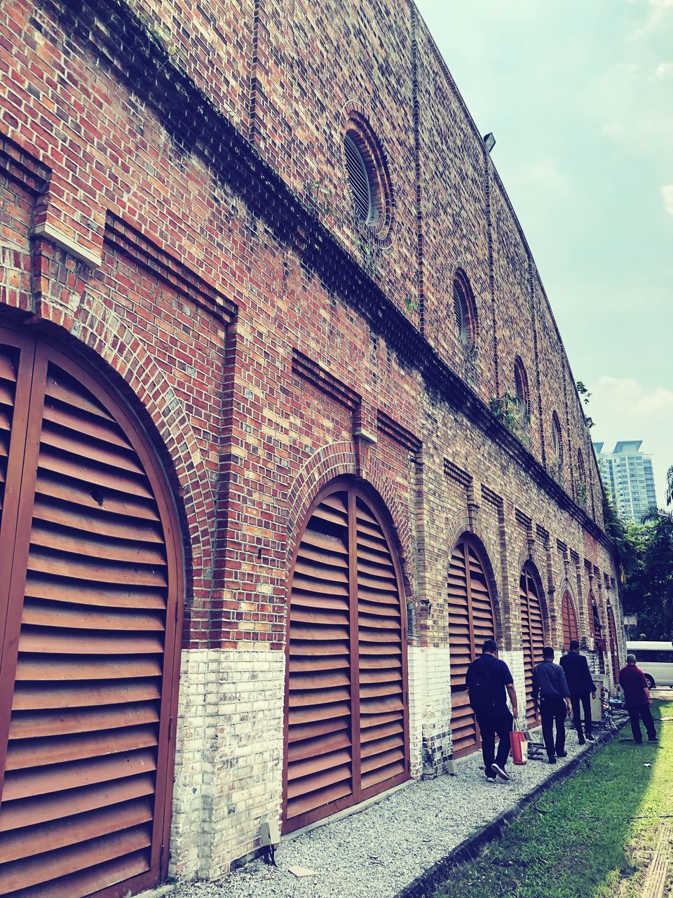 PEOPLE WALKING ON HISTORICAL BUILDING IN CITY