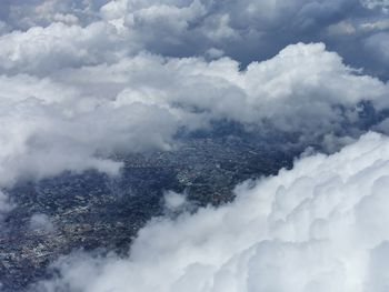 Aerial view of clouds over mountains