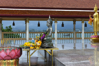 Sculpture outside temple by building