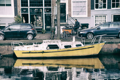 Boats moored in canal
