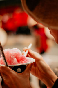 Midsection of woman holding ice cream