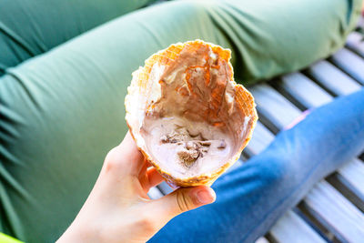 Midsection of person holding ice cream cone