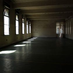 Empty corridor along pillars