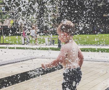 Boy playing in swimming pool