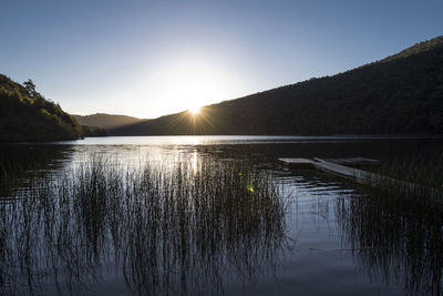 Sunset over still lake at the chilean lake district