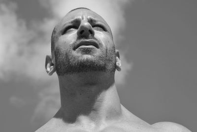 Portrait of young man looking up