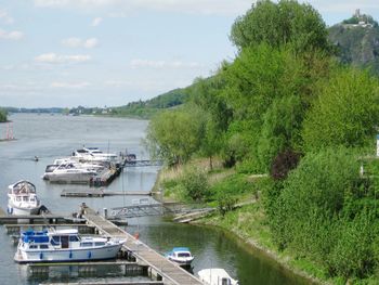 High angle view of boats moored in river against sky