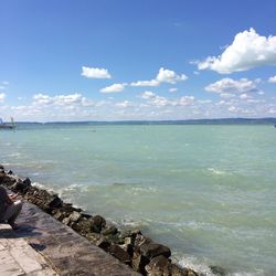 Scenic view of sea against cloudy sky