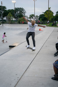 Low section of man skateboarding on skateboard