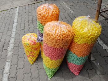 High angle view of snacks in plastic bags at footpath