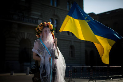 Iryna demonstrating at the bundesplatz, bern, one month after the russian invasion in ukraine 