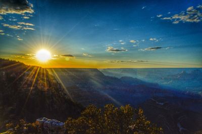 Scenic view of landscape against sky at sunset