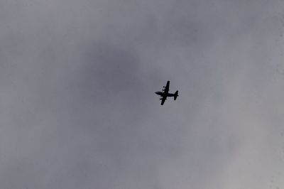 Low angle view of airplane flying in sky