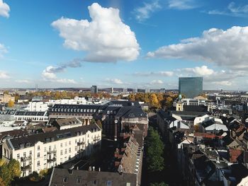 High angle view of buildings in city against sky