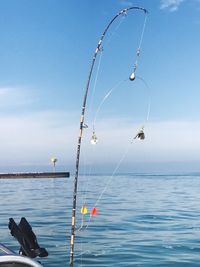 Close-up of hanging over sea against sky