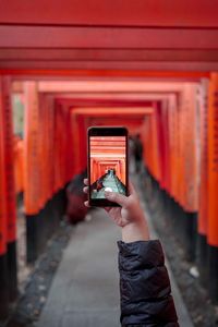 Man photographing with mobile phone