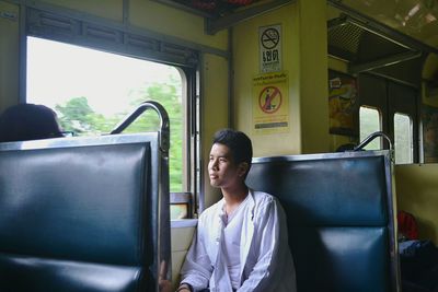 Young woman traveling in train