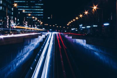 High angle view of light trails on road at night