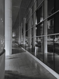 Reflection of person on glass building