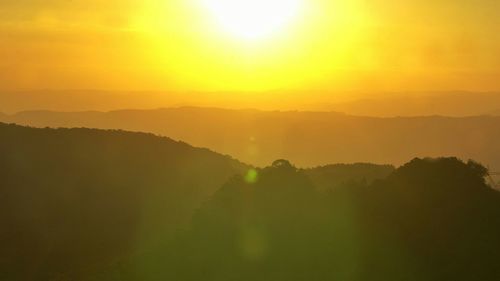 Sun shining over landscape