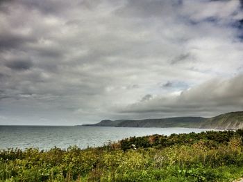 Scenic view of sea against cloudy sky