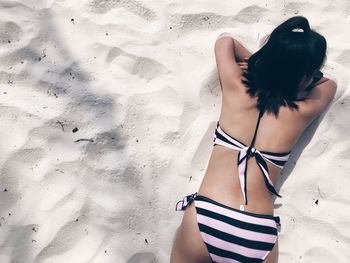 Rear view of woman at beach