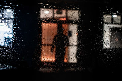 Close-up of wet glass window in rainy season