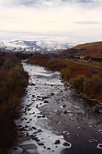 Scenic view of landscape against cloudy sky