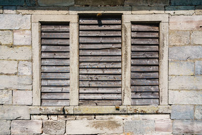 Low angle view of window on old building
