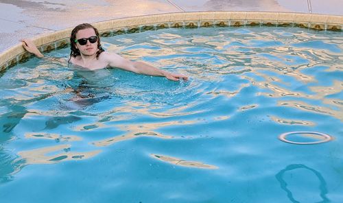 Portrait of woman swimming in pool