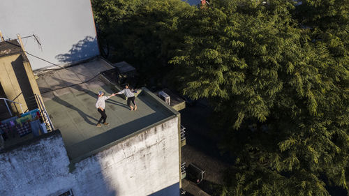 High angle view of people by plants