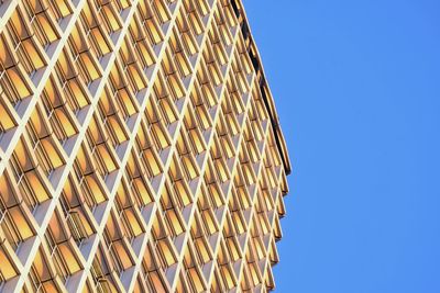 Low angle view of roof against clear blue sky