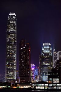 View of skyscrapers lit up at night